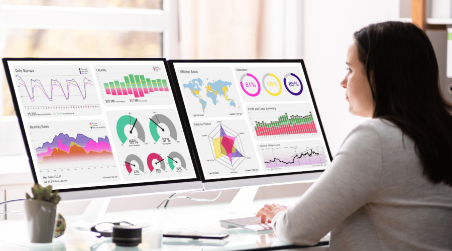 This image shows a marketer analyzing data in order to optimize marketing performance.