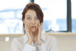 An image of that depicts a woman disappointed by her ad performance. We provide 5 ways to boost your ad performance.